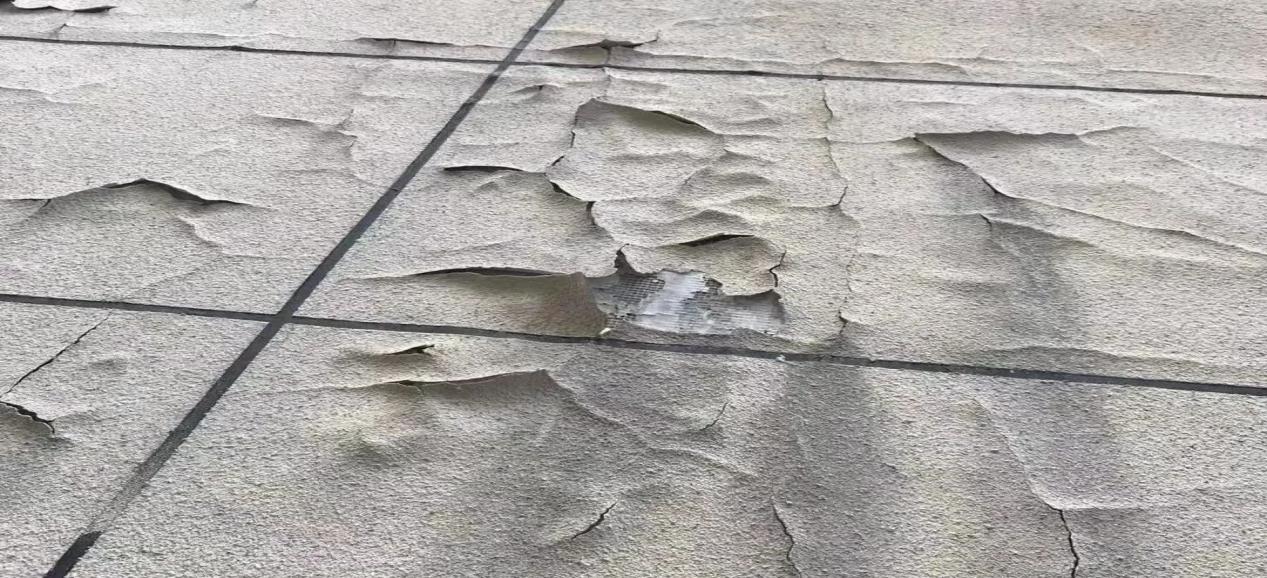 外墙仿石漆怎么选?久诺超耐久系统,解决褪色开裂脱落行业顽疾